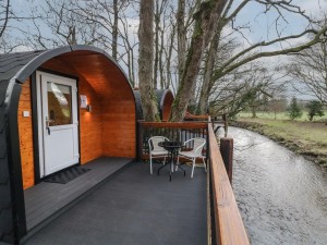 Lodge overlooking river on Kintala Resort